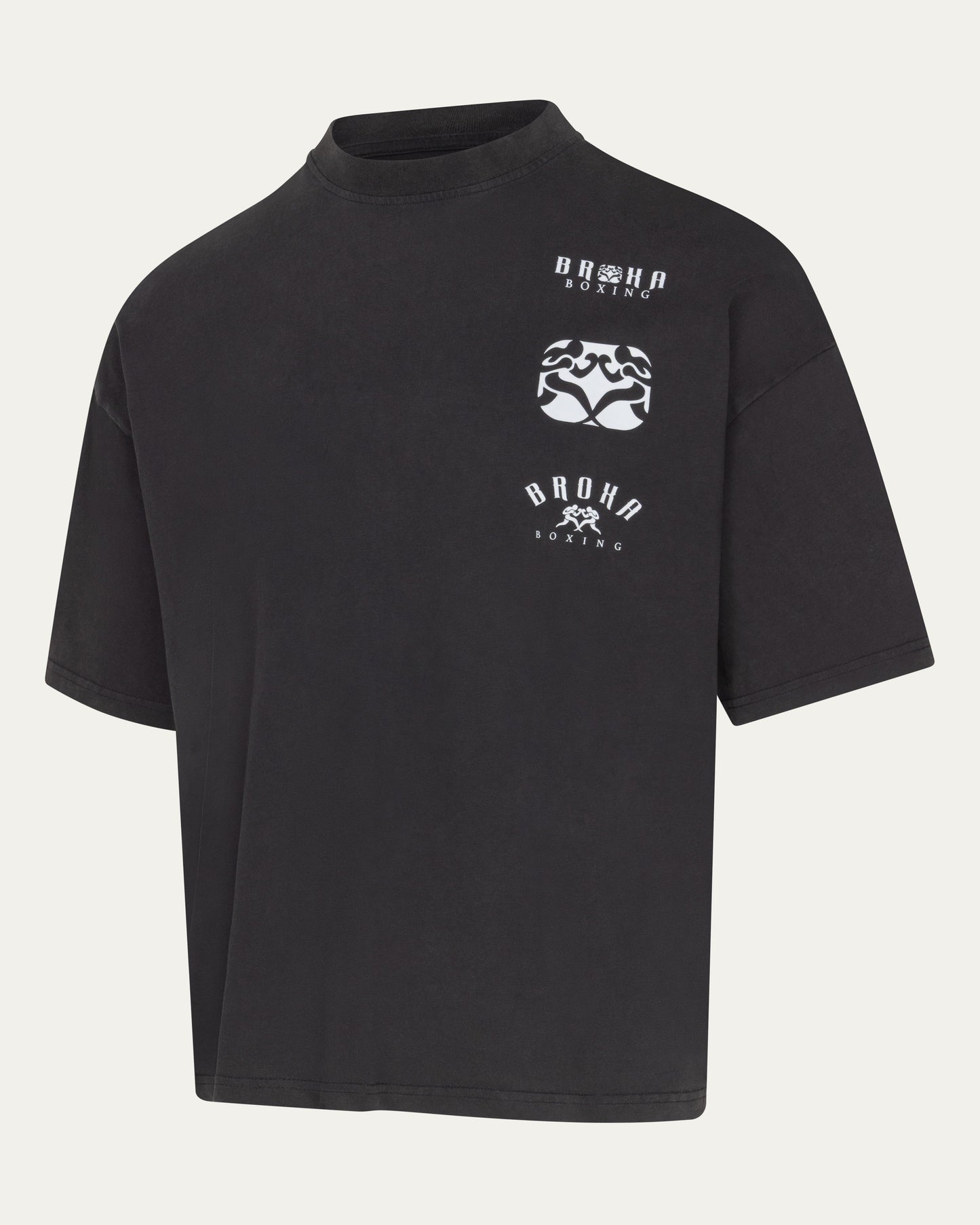 Black t-shirt with white graphics and text on a light gray background