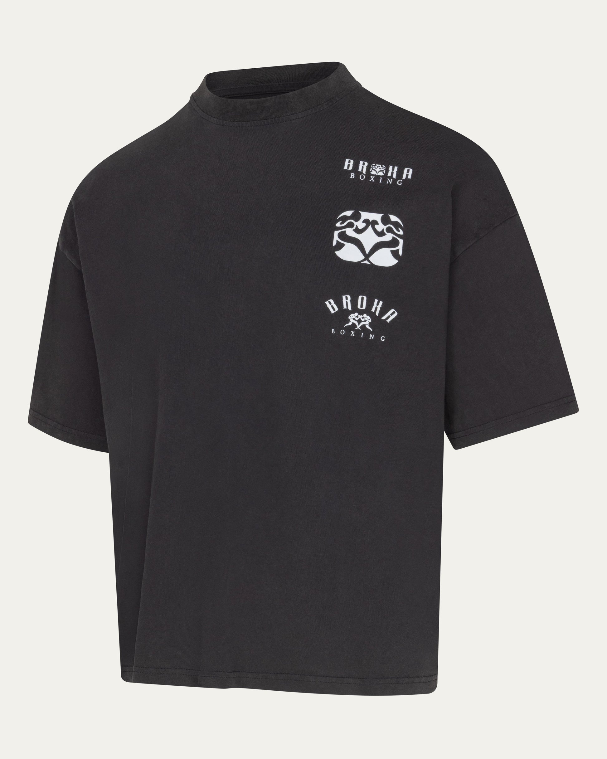 Black t-shirt with white graphics and text on a light gray background