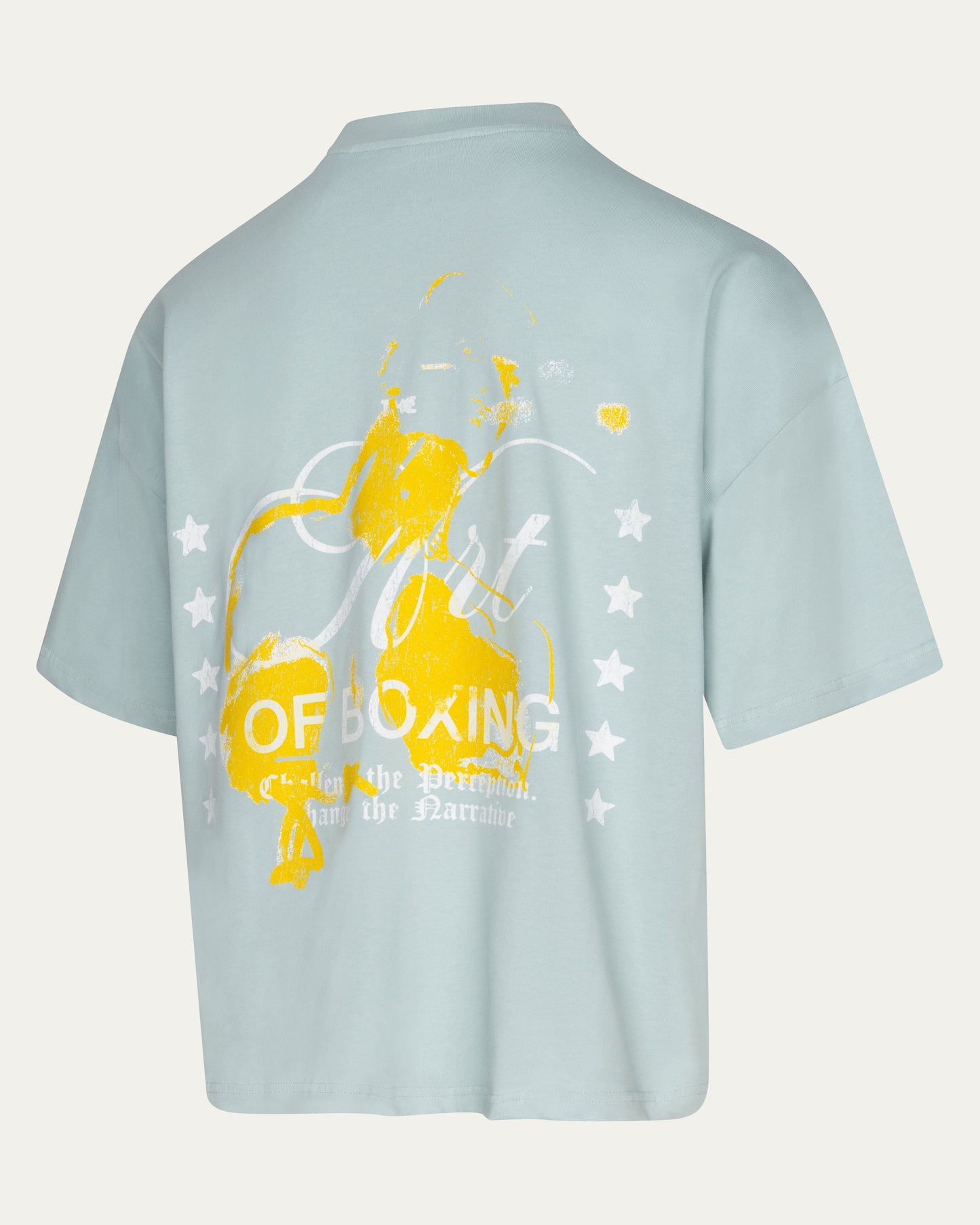 Light blue t-shirt with yellow boxing graphic and text on a light gray background